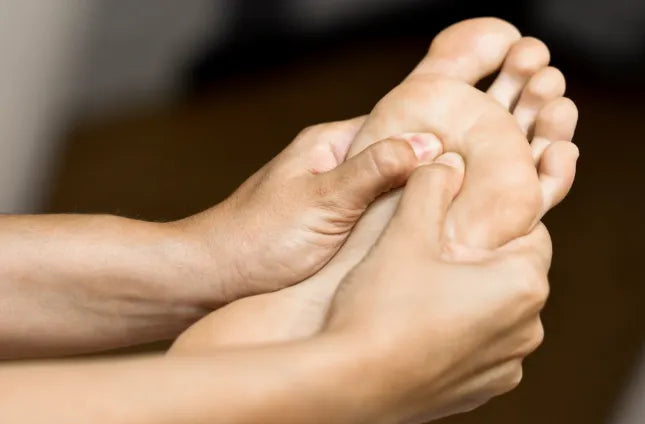 Medical massage at the foot in a physiotherapy center.