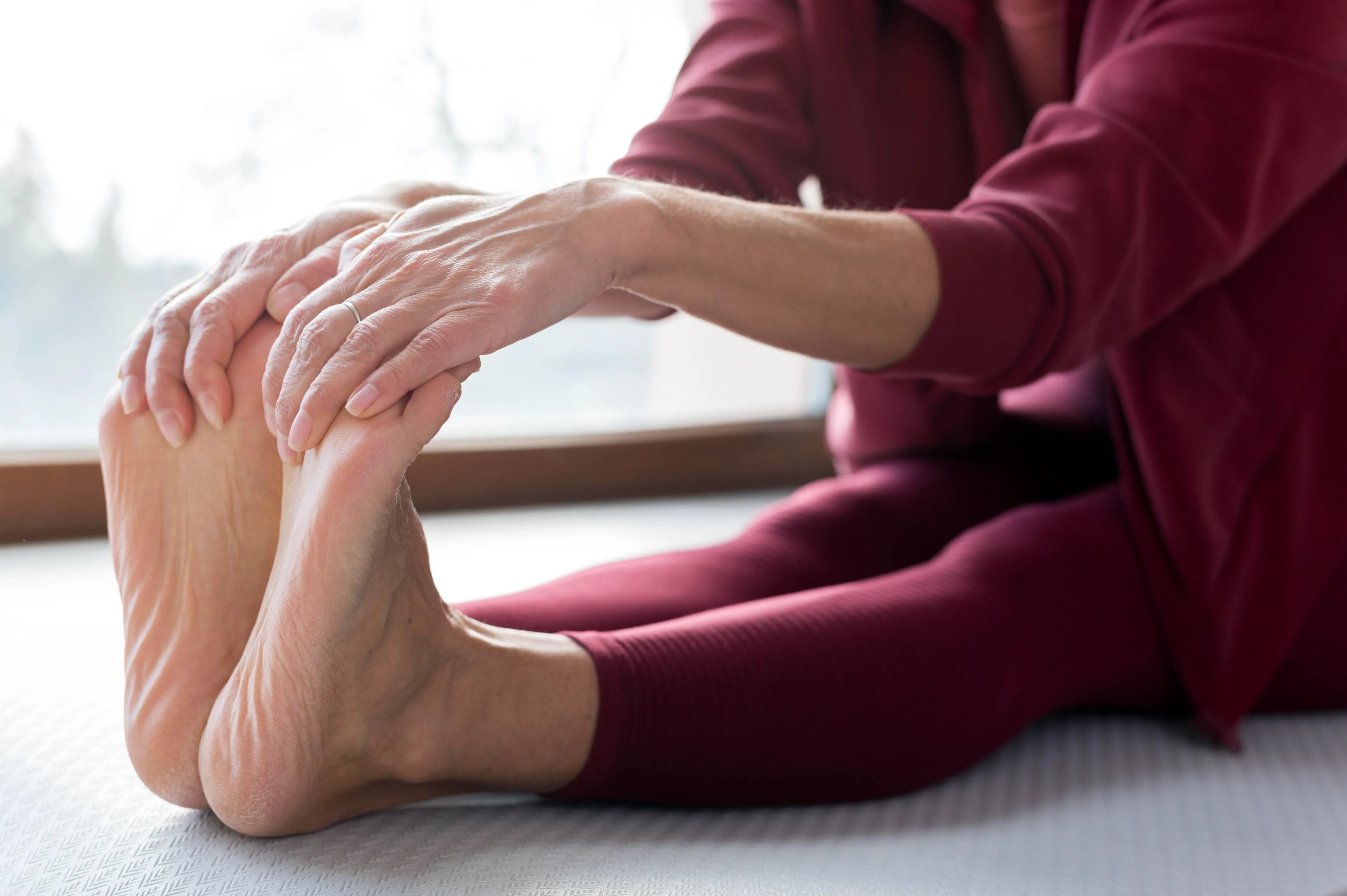 Close-up legs being stretched for sport